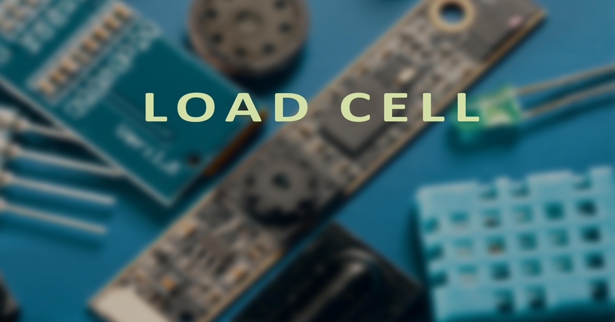 The words "Load Cell" displayed in bold letters with electrical components and circuit boards in the background.