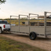 USA Measurements 8x15 Single Axle Livestock Trailer Scale - white pickup truck towing trailer at ranch with cattle pen at sunset